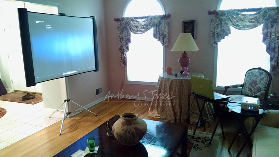 In-person ordering appointment with projection display of portraits